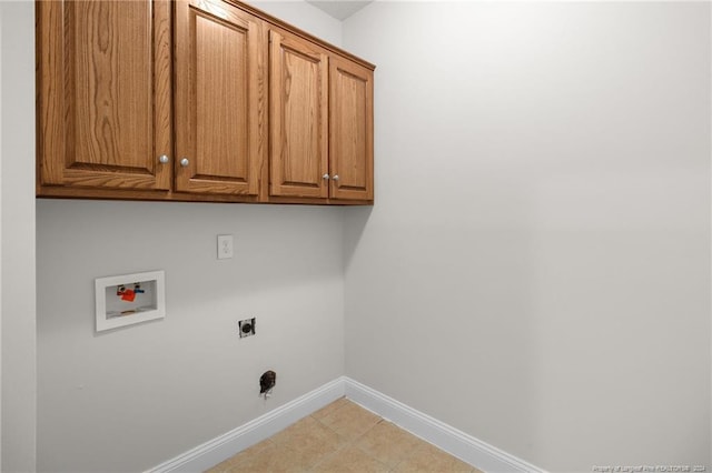 washroom with hookup for an electric dryer, cabinets, and hookup for a washing machine