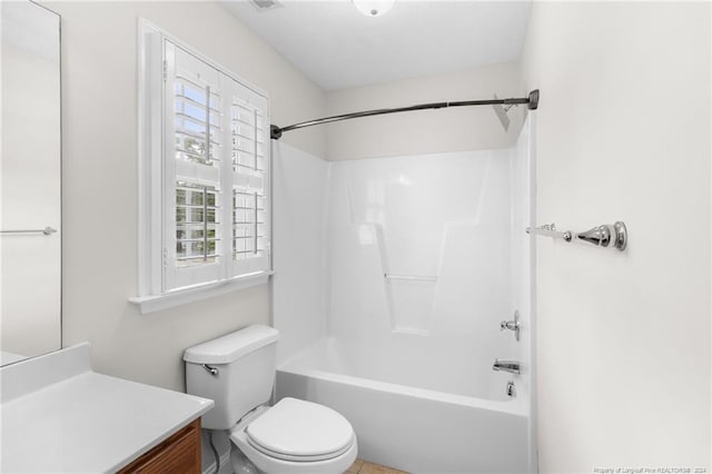 full bathroom featuring bathing tub / shower combination, vanity, and toilet