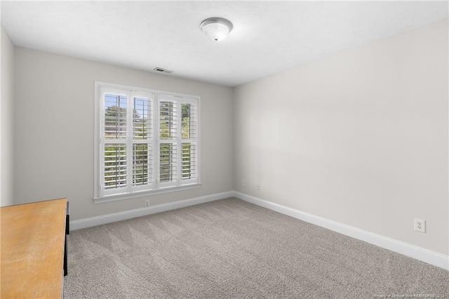 empty room with carpet flooring