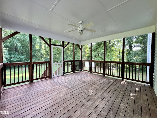 unfurnished sunroom with ceiling fan