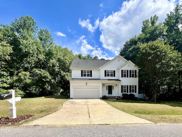 view of front of house featuring a garage and a front lawn