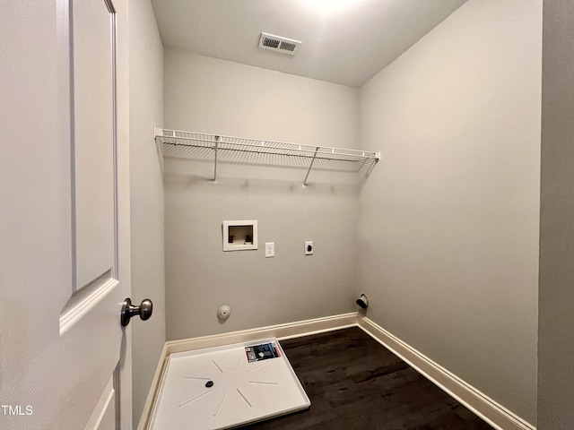 laundry area featuring hookup for an electric dryer, washer hookup, dark hardwood / wood-style flooring, and hookup for a gas dryer