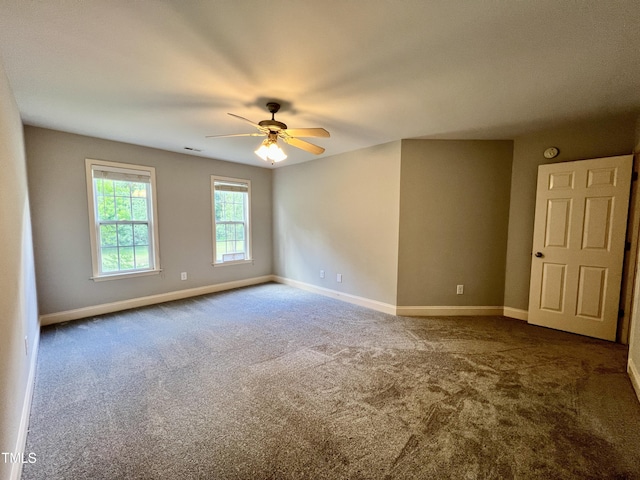 carpeted empty room with ceiling fan