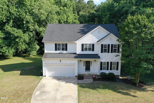 view of front of home featuring a front yard and a garage