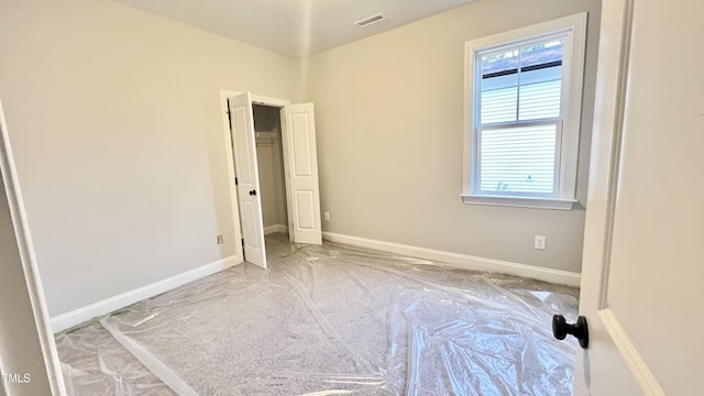 unfurnished bedroom with light carpet