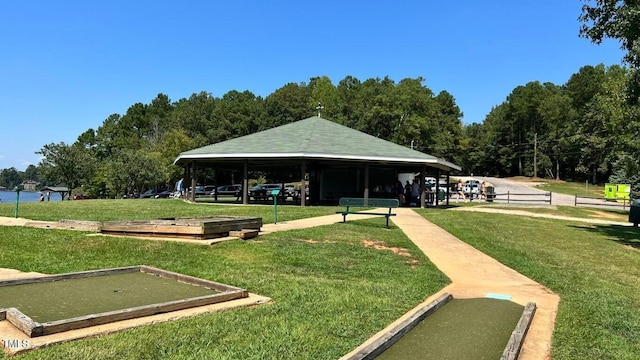 view of home's community with a yard