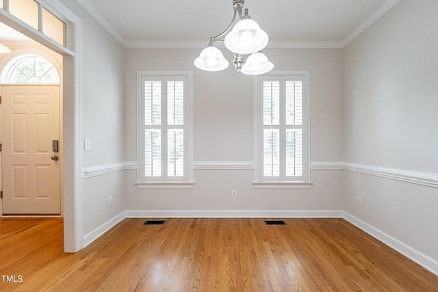 interior space featuring light hardwood / wood-style flooring, a chandelier, and a healthy amount of sunlight