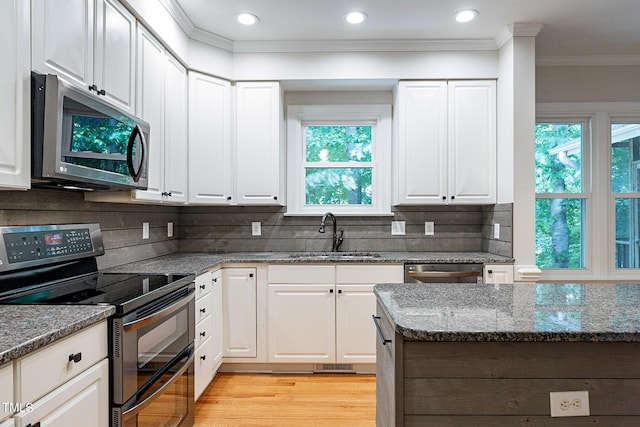 kitchen with white cabinetry and stainless steel appliances