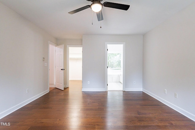 unfurnished room with dark wood-type flooring and ceiling fan