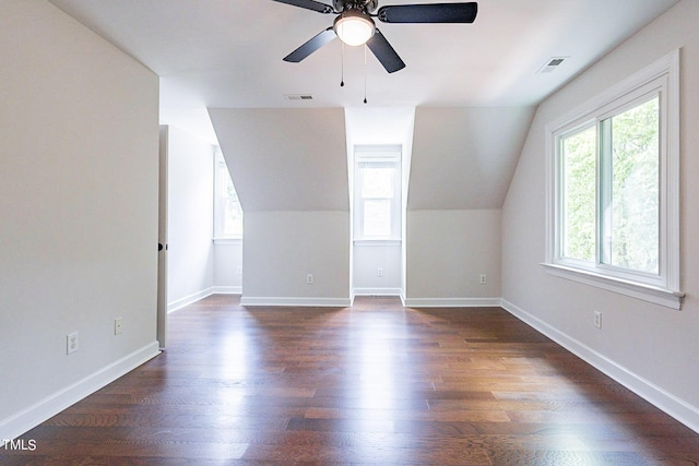 additional living space with ceiling fan, dark wood-type flooring, and lofted ceiling