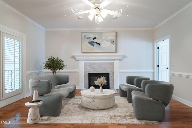 living room featuring crown molding, dark wood-type flooring, and a tile fireplace