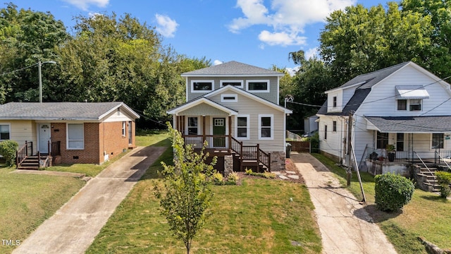 bungalow-style home featuring a front lawn and a porch