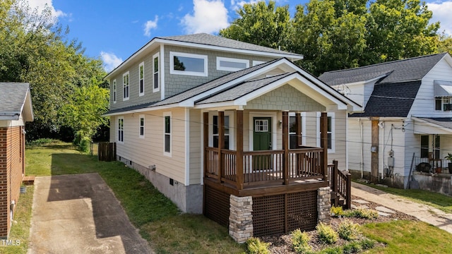 bungalow-style house with a front lawn