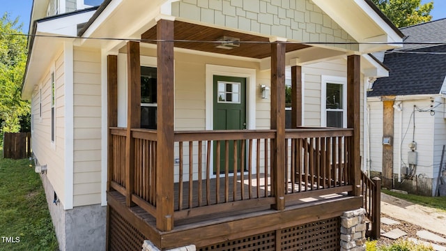 view of exterior entry featuring covered porch