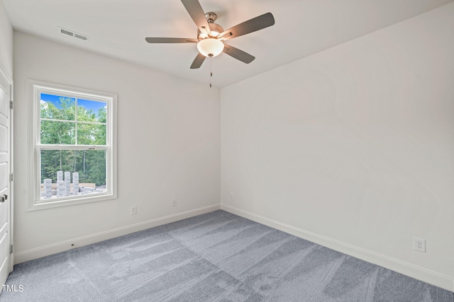 unfurnished room with ceiling fan and light colored carpet