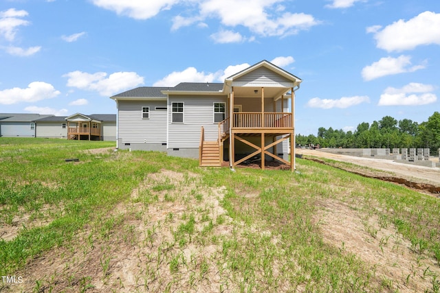 back of house with a wooden deck