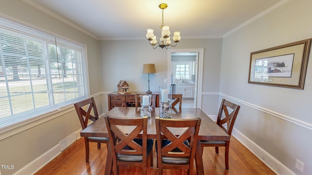 dining area featuring hardwood / wood-style floors and plenty of natural light