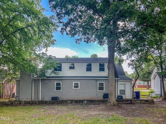 back of property with central AC unit