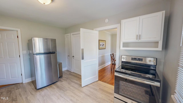 kitchen featuring light hardwood / wood-style floors, white cabinets, and stainless steel appliances