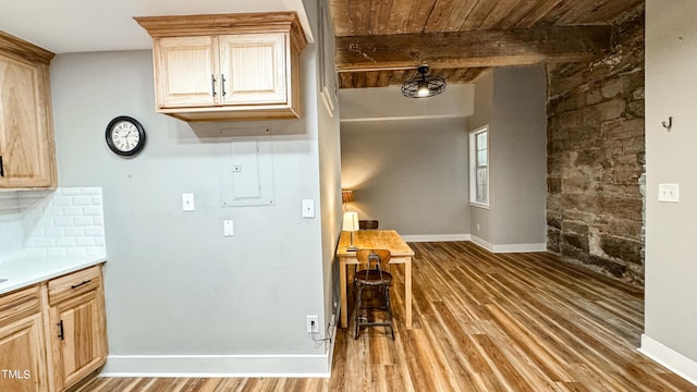 kitchen with beamed ceiling, wooden ceiling, light brown cabinets, hardwood / wood-style flooring, and decorative backsplash