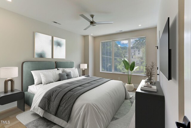 bedroom featuring ceiling fan and light hardwood / wood-style floors