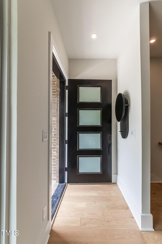 corridor featuring light wood-type flooring