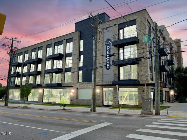 view of outdoor building at dusk