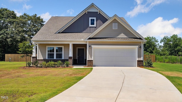 craftsman-style home featuring a garage and a front yard