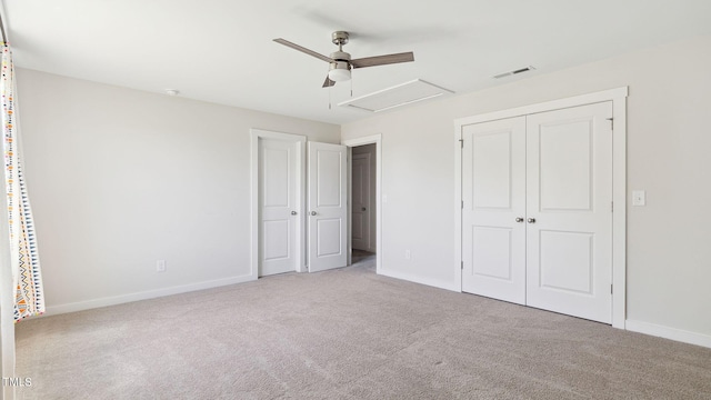 unfurnished bedroom featuring ceiling fan and light carpet