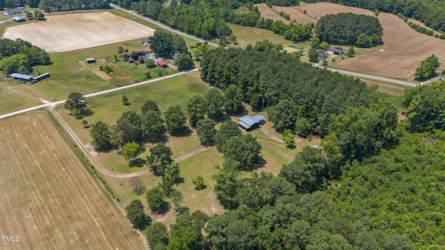 birds eye view of property with a rural view