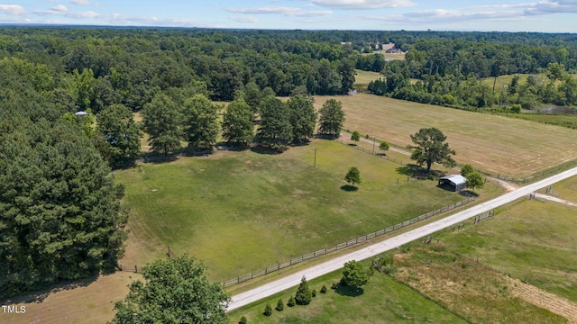 birds eye view of property with a rural view