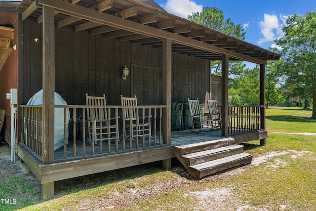 wooden terrace featuring covered porch