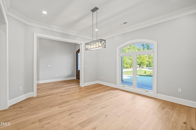 unfurnished dining area featuring light hardwood / wood-style floors and ornamental molding