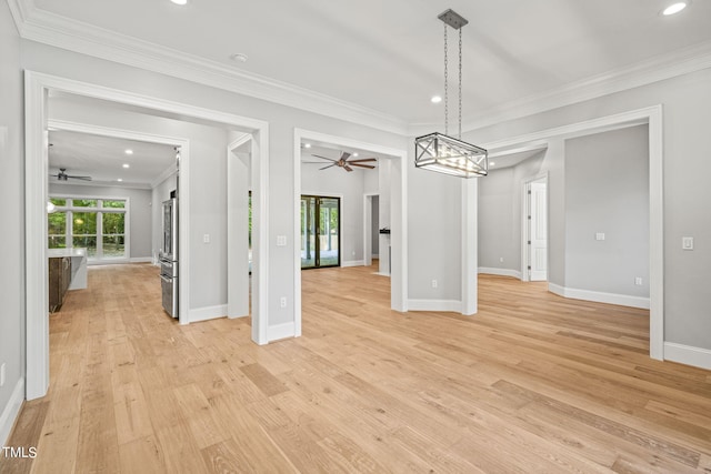 unfurnished dining area featuring ceiling fan, light hardwood / wood-style flooring, and ornamental molding