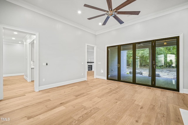 spare room featuring ceiling fan, light hardwood / wood-style flooring, and ornamental molding