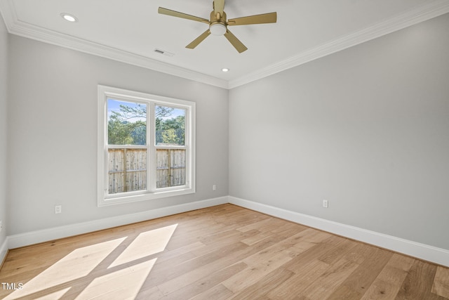 spare room featuring ornamental molding, ceiling fan, and light hardwood / wood-style flooring