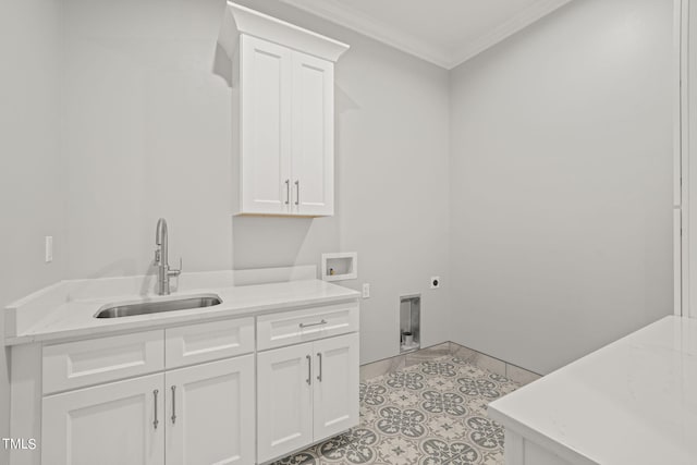 laundry area featuring sink, cabinets, hookup for a washing machine, crown molding, and electric dryer hookup