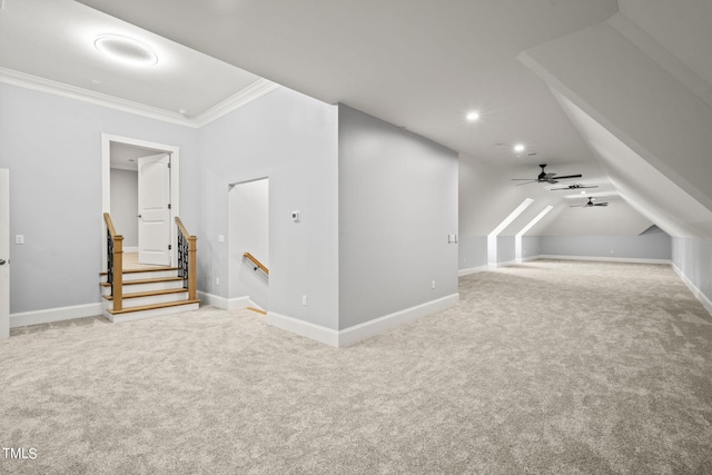 bonus room with carpet flooring and ceiling fan