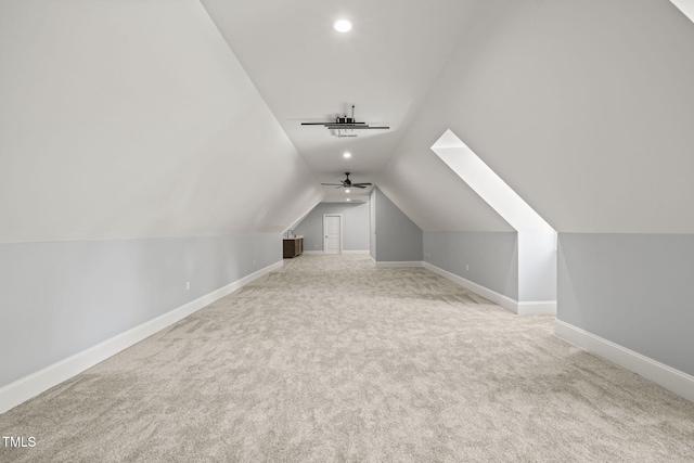 additional living space featuring carpet, vaulted ceiling, and ceiling fan