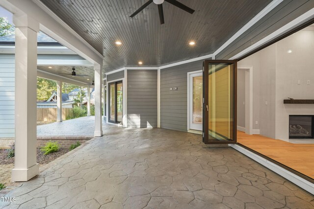 view of patio featuring ceiling fan