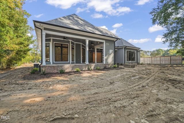 rear view of house featuring ceiling fan