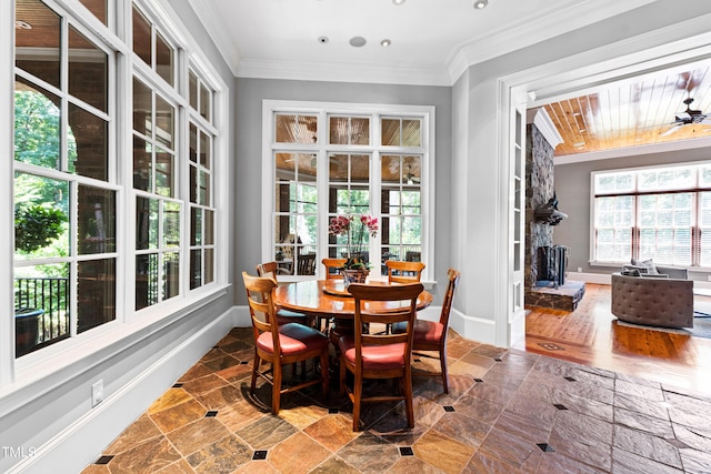 dining space featuring crown molding and ceiling fan