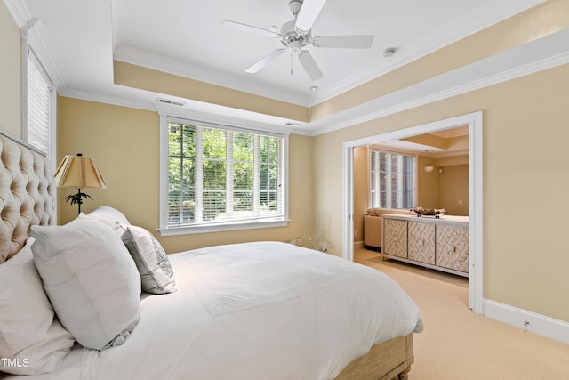 carpeted bedroom featuring a tray ceiling, ceiling fan, and crown molding