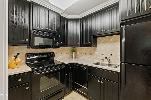 kitchen with backsplash, sink, light tile patterned floors, and black appliances