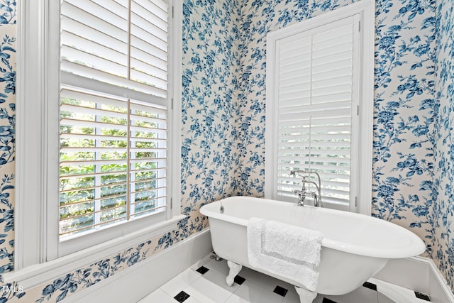 1820 Oatlands Ct, Wake Forest, NC 27587 - full bathroom featuring wallpapered walls, a freestanding tub, and tile patterned floors