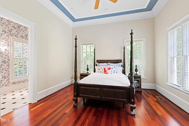 bedroom featuring multiple windows, ceiling fan, and crown molding