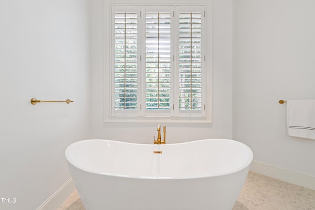 bathroom with a washtub