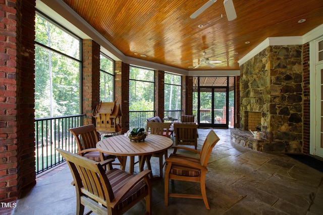 dining room with a wealth of natural light, ceiling fan, wood ceiling, and ornamental molding