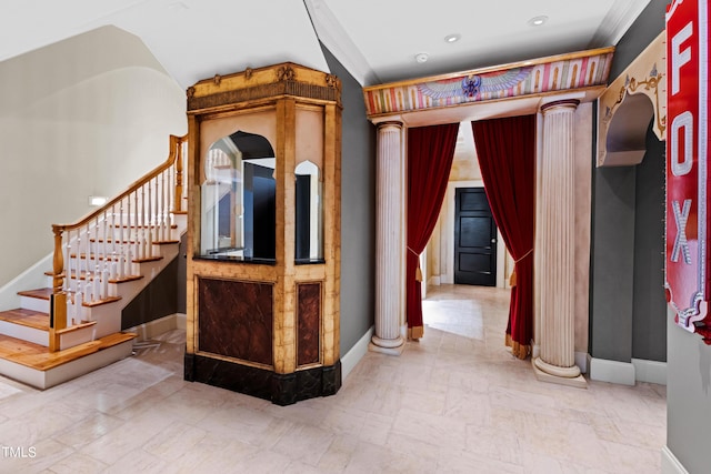 interior space featuring decorative columns and ornamental molding