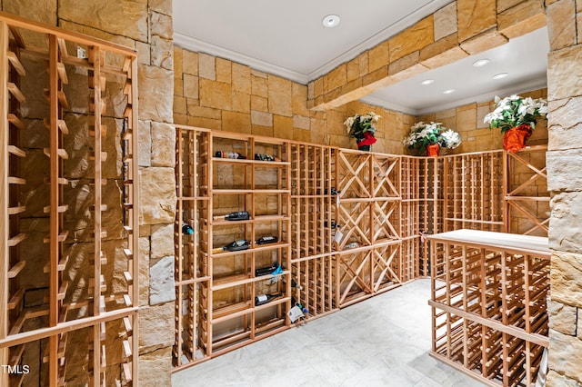 wine room featuring ornamental molding